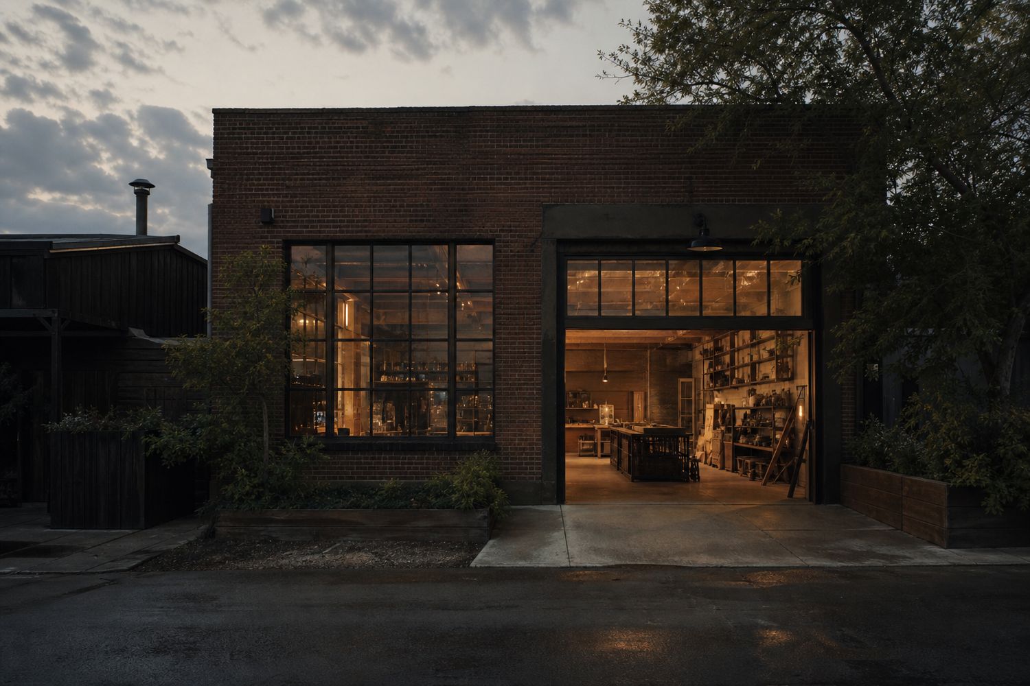 Brick workshop exterior with warm light at dawn